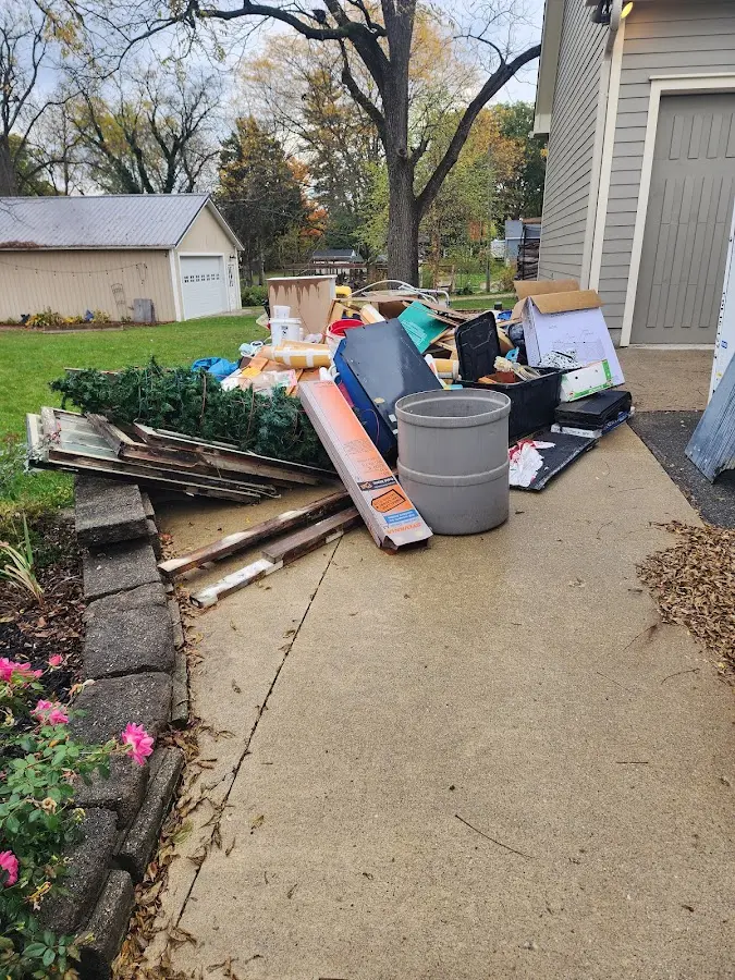 Dumpster being loaded with debris for 30 Yard Dumpster Rental in Arvin